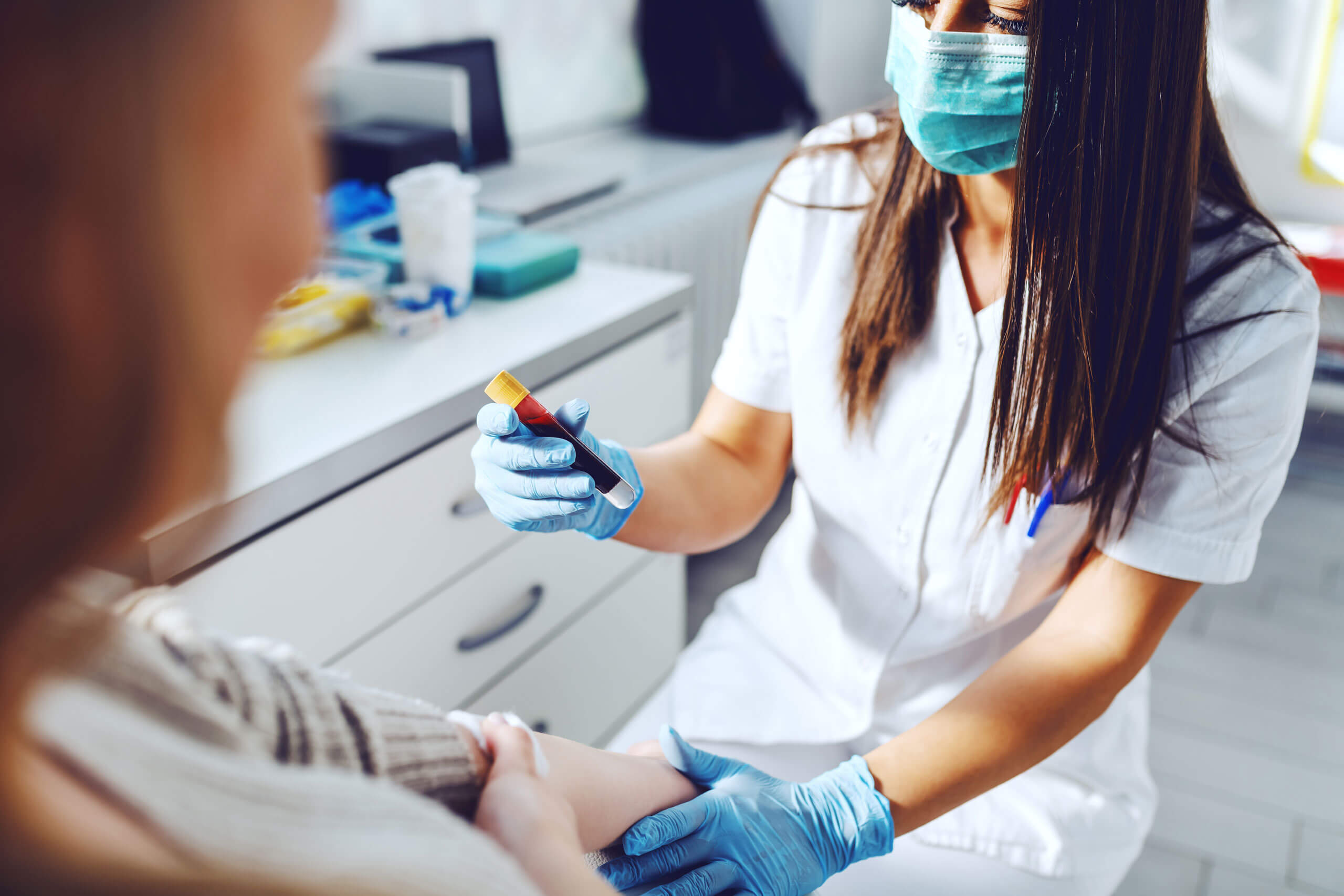 Phlebotomist checking label